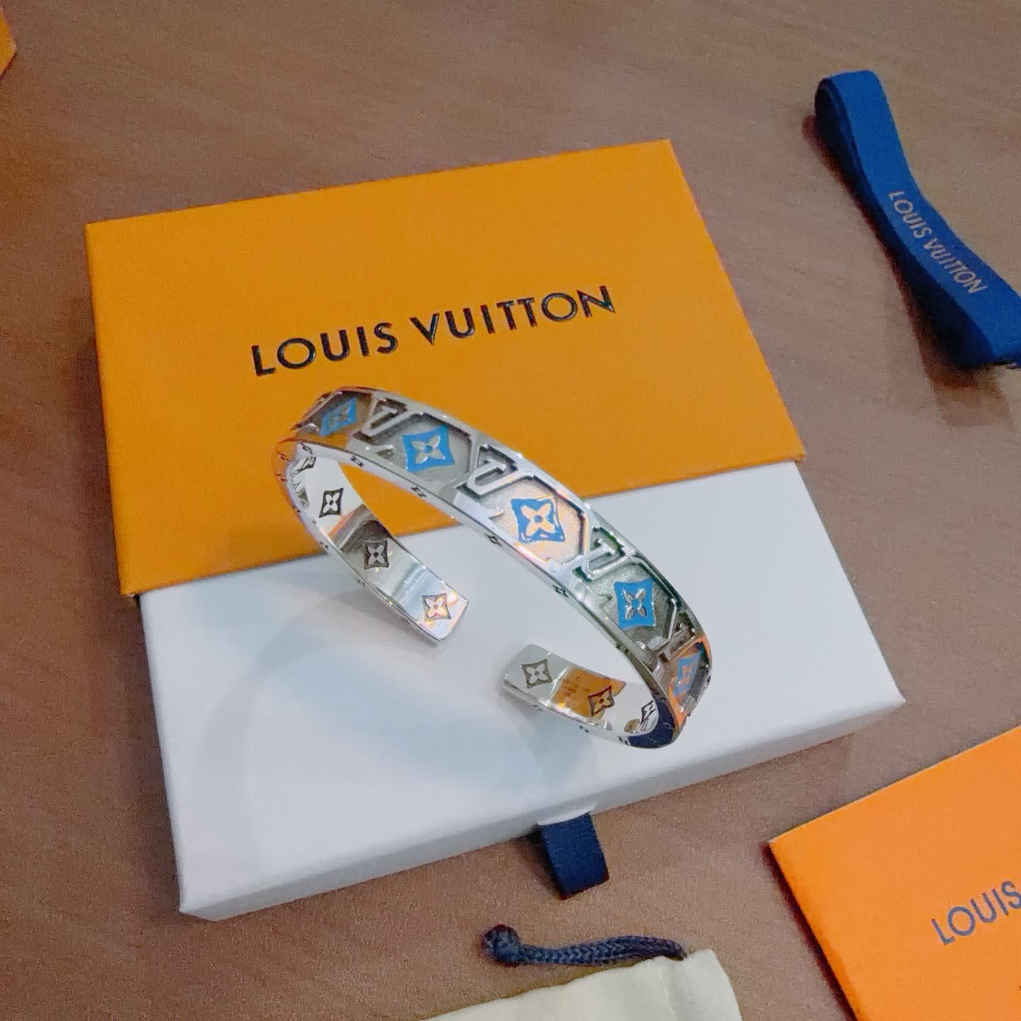 Louis Vuitton Silver Bracelet with Blue and Orange Accents